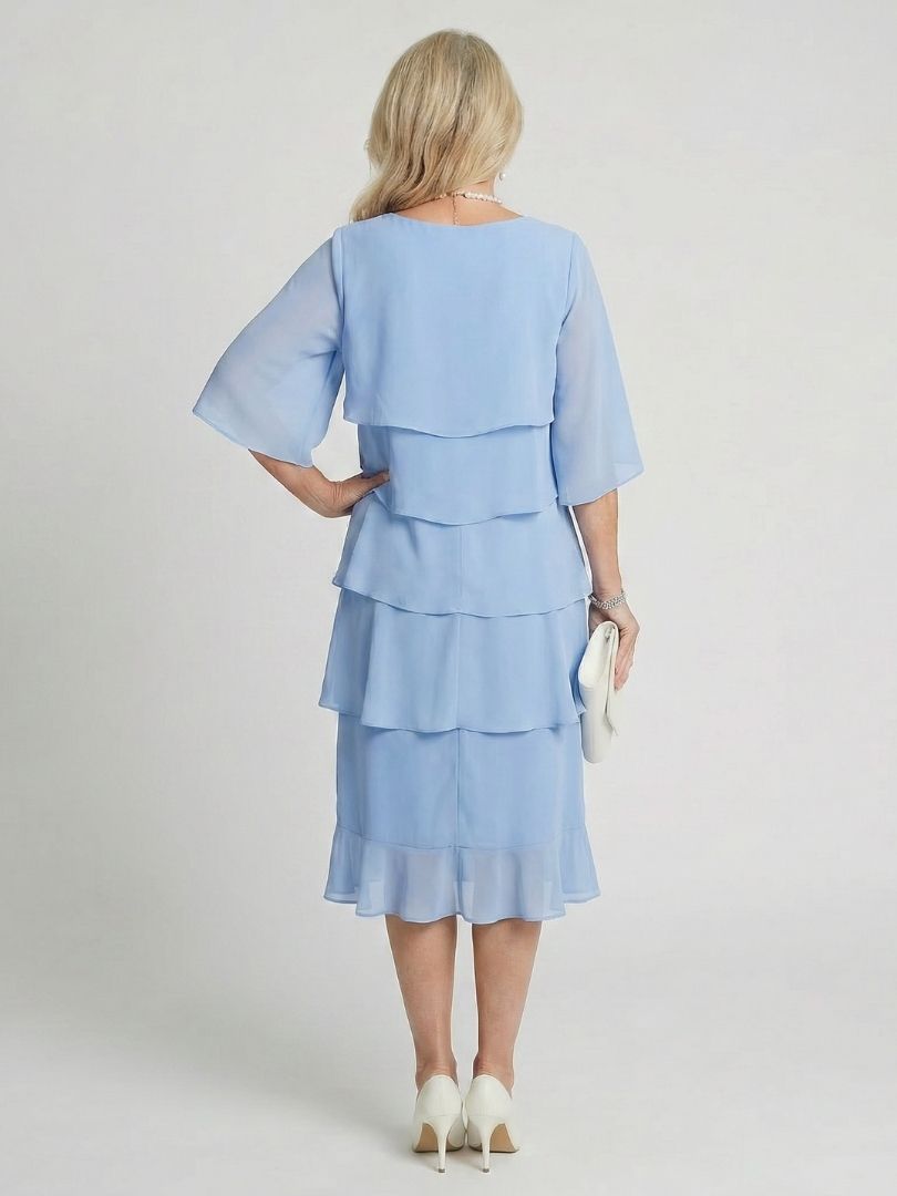 Stylish women's midi dress with a layered tier design, perfect for comfortable spring and summer fashion.