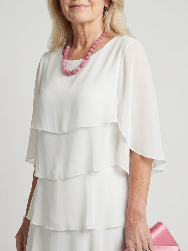 Detail of the round neck on the women's Brent layered midi dress, designed for comfort and style.