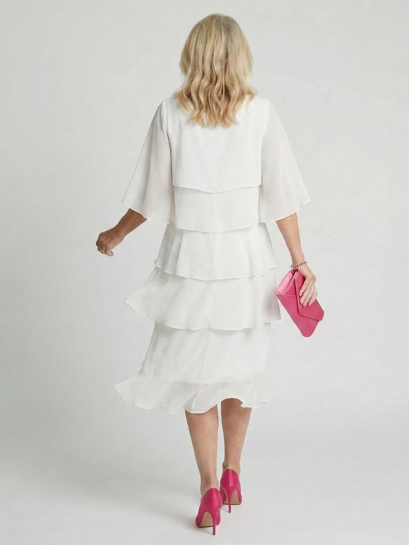 Women's tiered midi dress, demonstrating its relaxed fit and flowy movement for spring fashion.