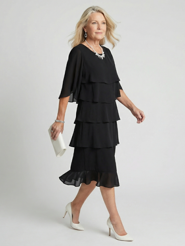 Elegant women's tiered midi dress, showcasing its relaxed fit and comfortable flowy design.