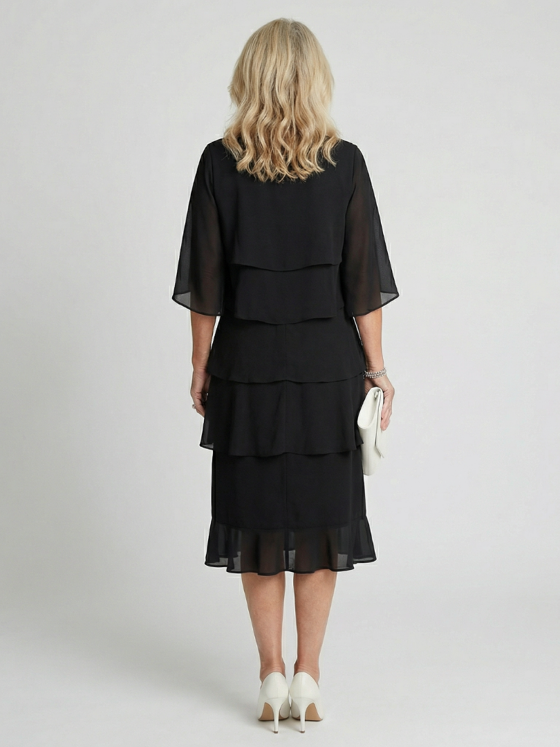 Flowy tiered midi dress for women, featuring a round neck and comfortable, relaxed fit for summer fashion.