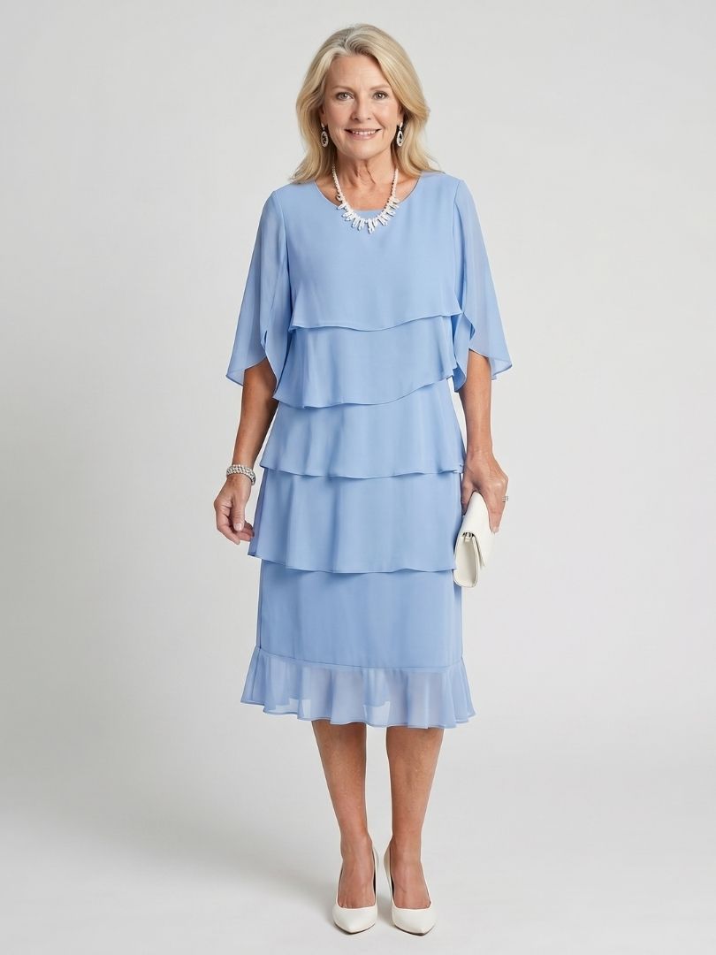 Back view of the women's tiered midi dress, showing its elegant drape and round neck design.