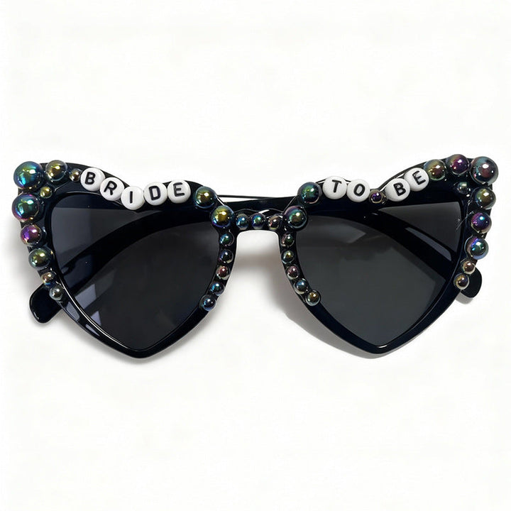 Elegant pearl-embellished cat-eye sunglasses for brides. Chic bridal eyewear, ideal for wedding parties & photo ops. UV400.