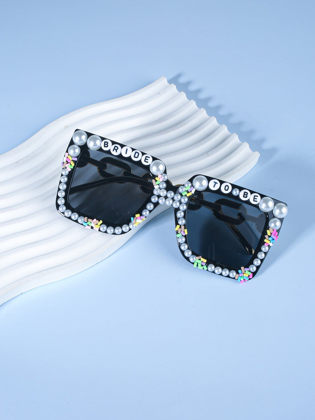 Trendy women's celebration shades, the ultimate accessory for a modern bridal party.