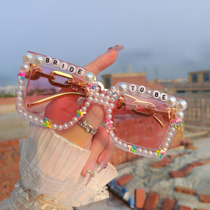 Bridal party sunglasses for bridesmaids & guests, a chic wedding fashion accessory.