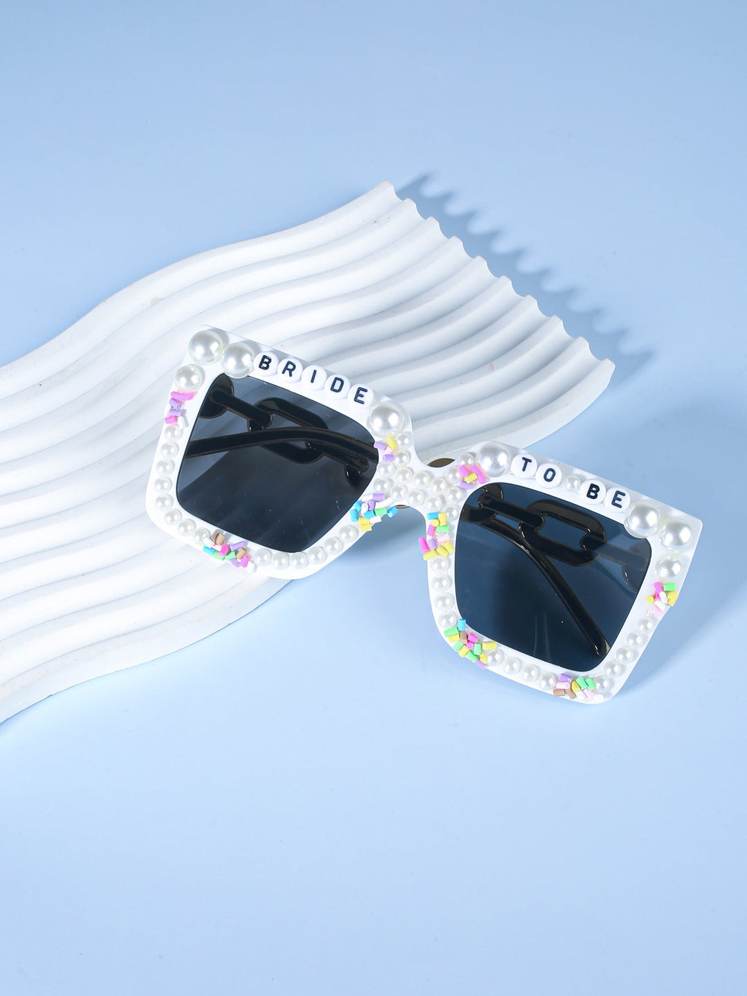 Festive women's party sunglasses, a must-have bridal accessory for bachelorette fun.