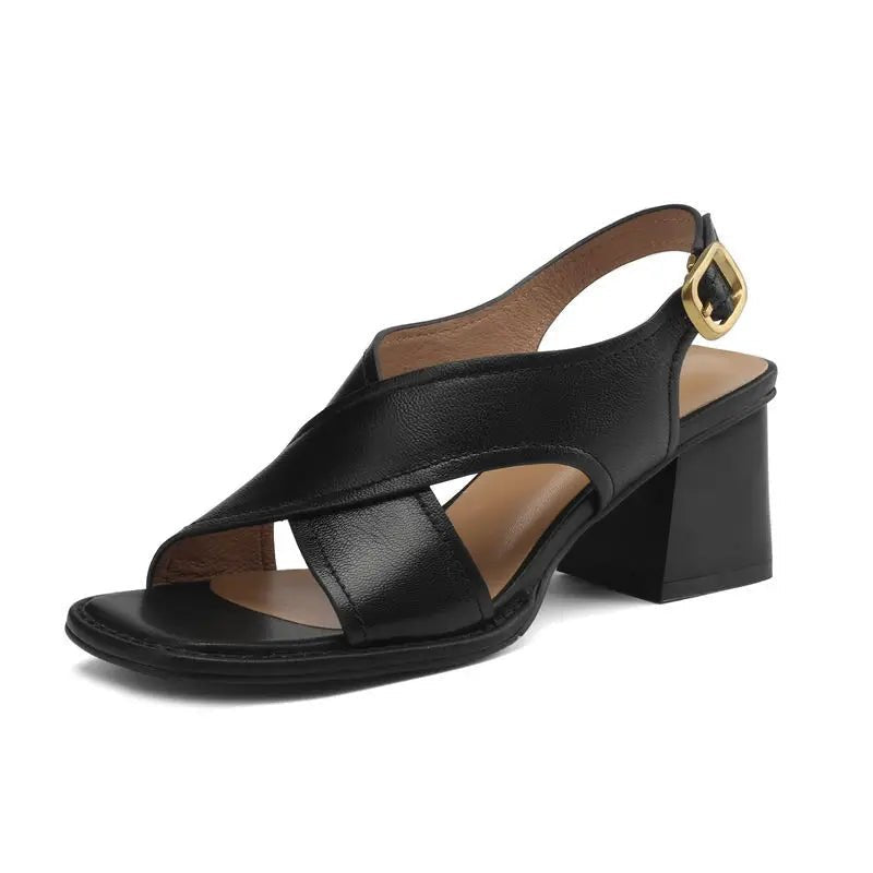 Women's stylish black leather block heel sandals, designed with a fisherman crossover front and slingback strap.