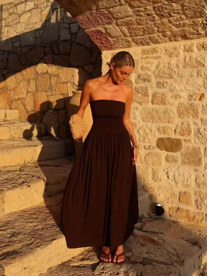 Casual chic brown strapless maxi dress, featuring a beautiful pleated design for summer fashion.