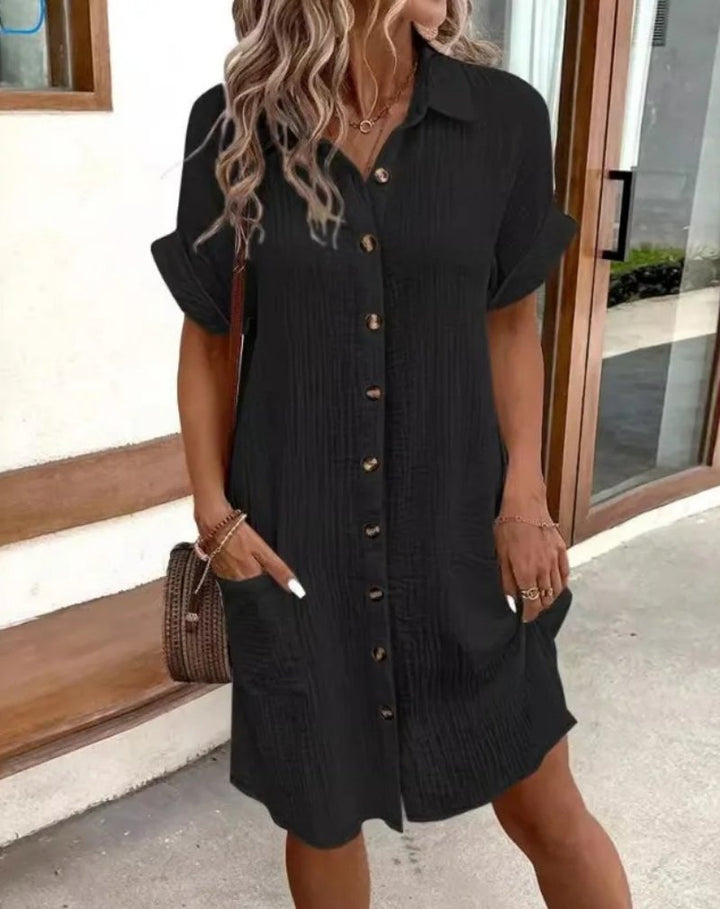 Effortless style in a women's collared shirt dress; short sleeve, relaxed fit, ideal for casual summer fashion.