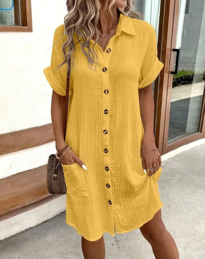 Chic women's casual button-down shirt dress. Collared, short-sleeve design for comfortable everyday summer wear.