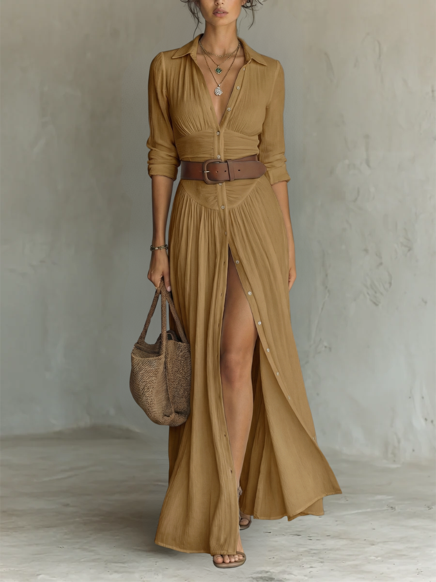 Close-up of a women's button-down maxi dress, long sleeves, collared. Showcases fabric and ruched waist detail.