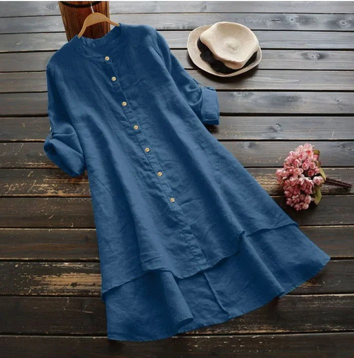 Women's button-down midi shirt dress with layered hem. Versatile spring/summer casual wear.