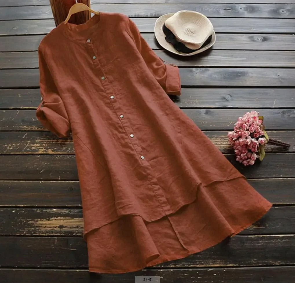 Chic long sleeve button-down women's dress, midi length. Features a distinctive layered hem.