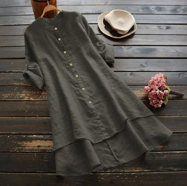 Women's versatile button-down midi dress with a stylish layered hem. Elegant long sleeve shirt dress.