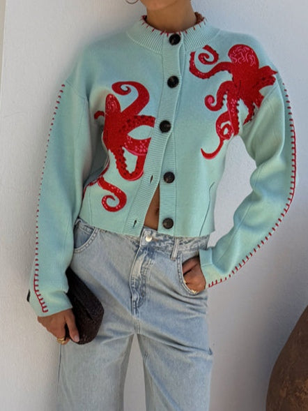Casual women's button-front cardigan adorned with a unique octopus pattern. Long sleeve for comfortable everyday wear.