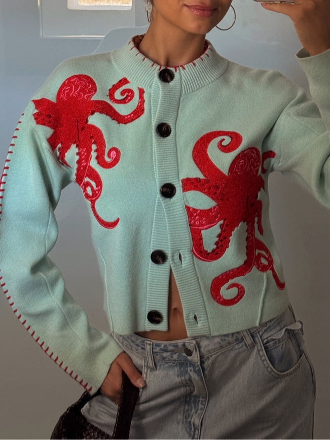 Vibrant octopus pattern on a women's long sleeve button-front cardigan. A unique graphic print ideal for layering.