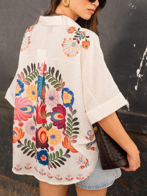 Stylish women's printed collared blouse with button front, ideal for everyday casual wear & summer fashion.