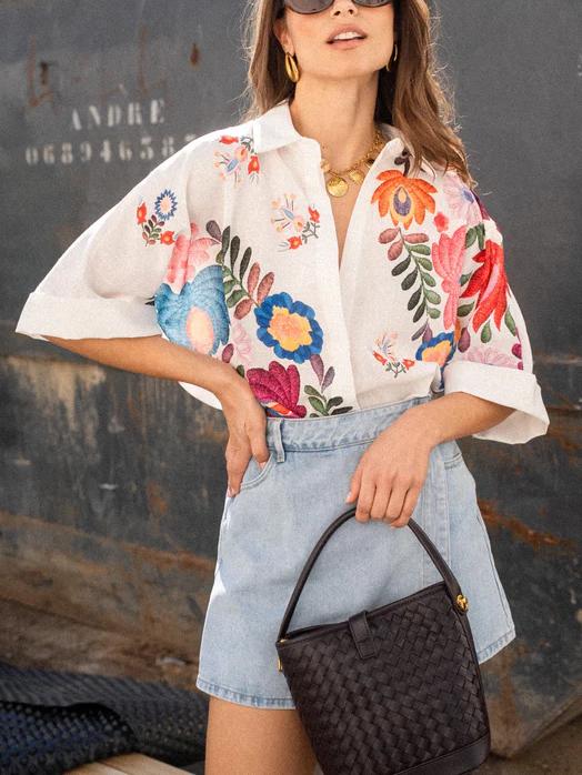 Chic ladies' short sleeve printed blouse, collared and button-front. Versatile for office or casual autumn fashion.