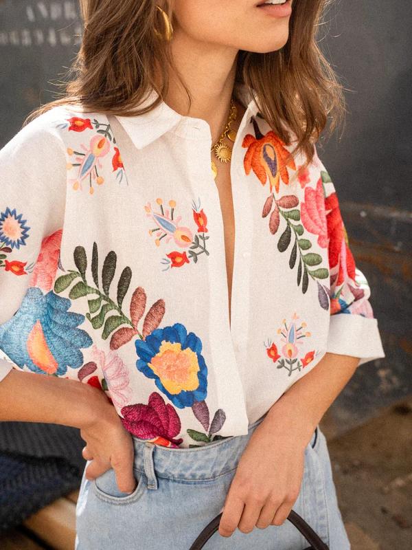 Elegant women's printed short sleeve blouse with a crisp collar & button front. Perfect for a refined casual look.