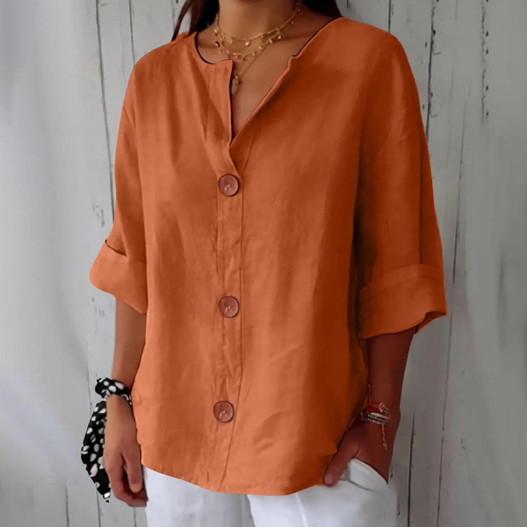 Women's button front linen blouse with three-quarter sleeves, perfect for a relaxed, stylish look.