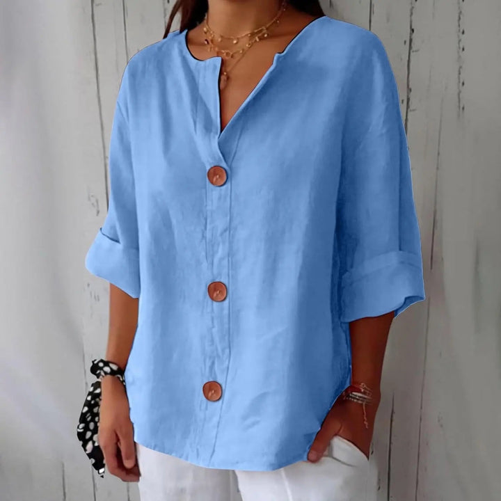 Fashionable women's linen blouse with a button front design and elegant three-quarter sleeves. A spring essential.