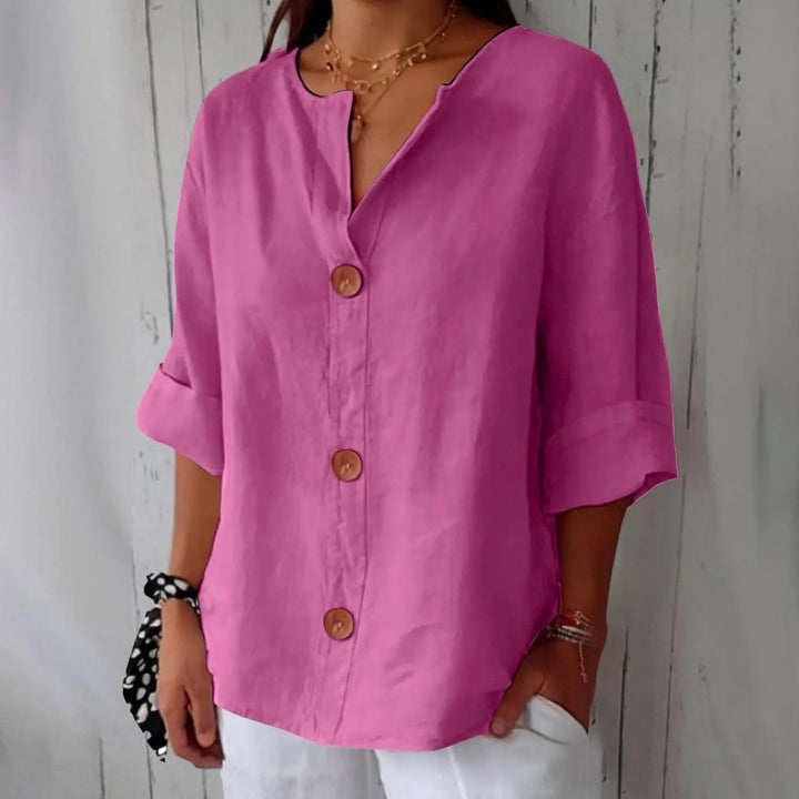 Versatile women's linen blouse featuring button front & three-quarter sleeves. A stylish, comfortable top for any occasion.