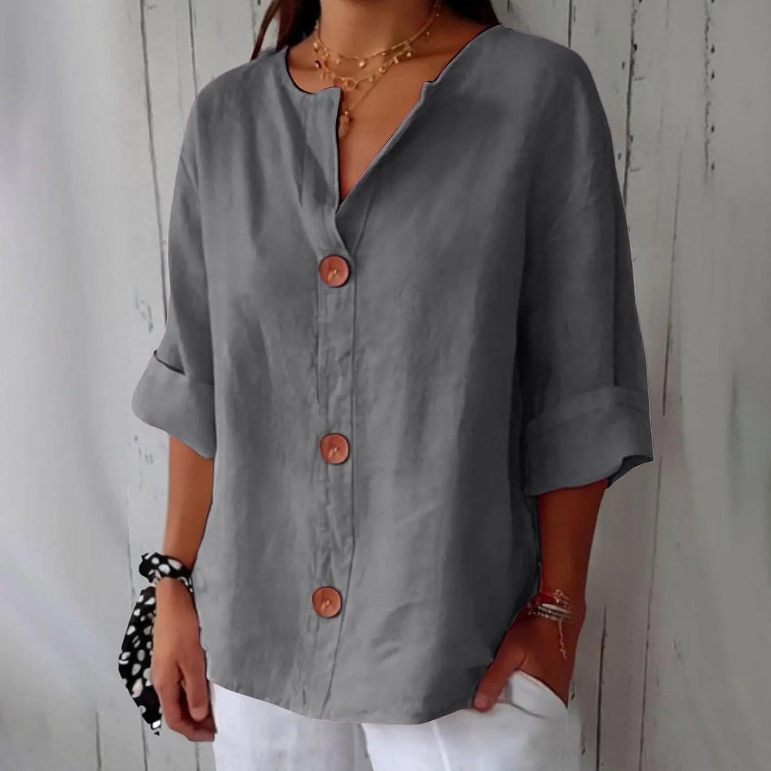 Elegant women's linen blouse, button front, three-quarter sleeves, ideal for spring & summer casual wear.