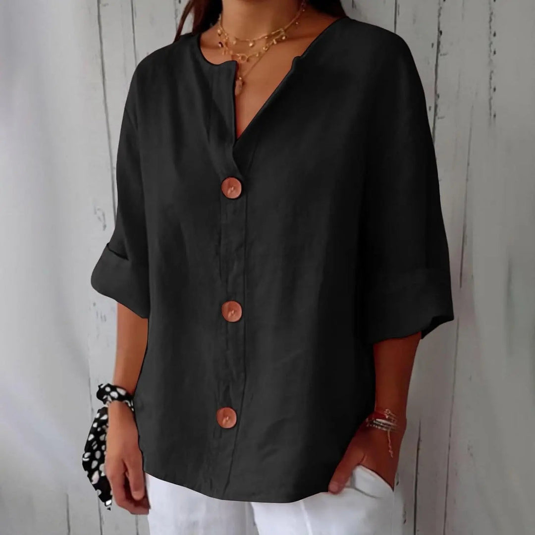 Effortless women's linen button front blouse with three-quarter sleeves, perfect for a chic and relaxed everyday style.