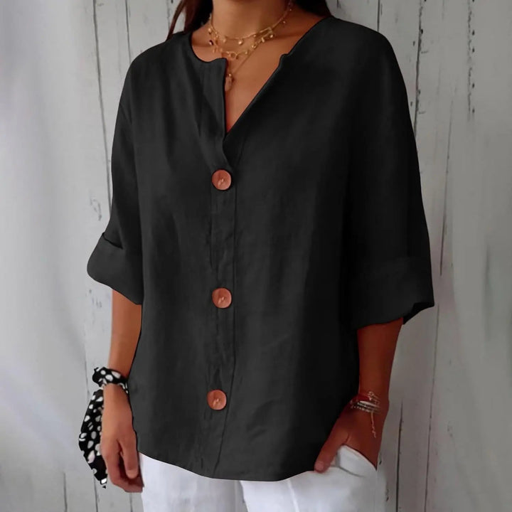 Effortless women's linen button front blouse with three-quarter sleeves, perfect for a chic and relaxed everyday style.