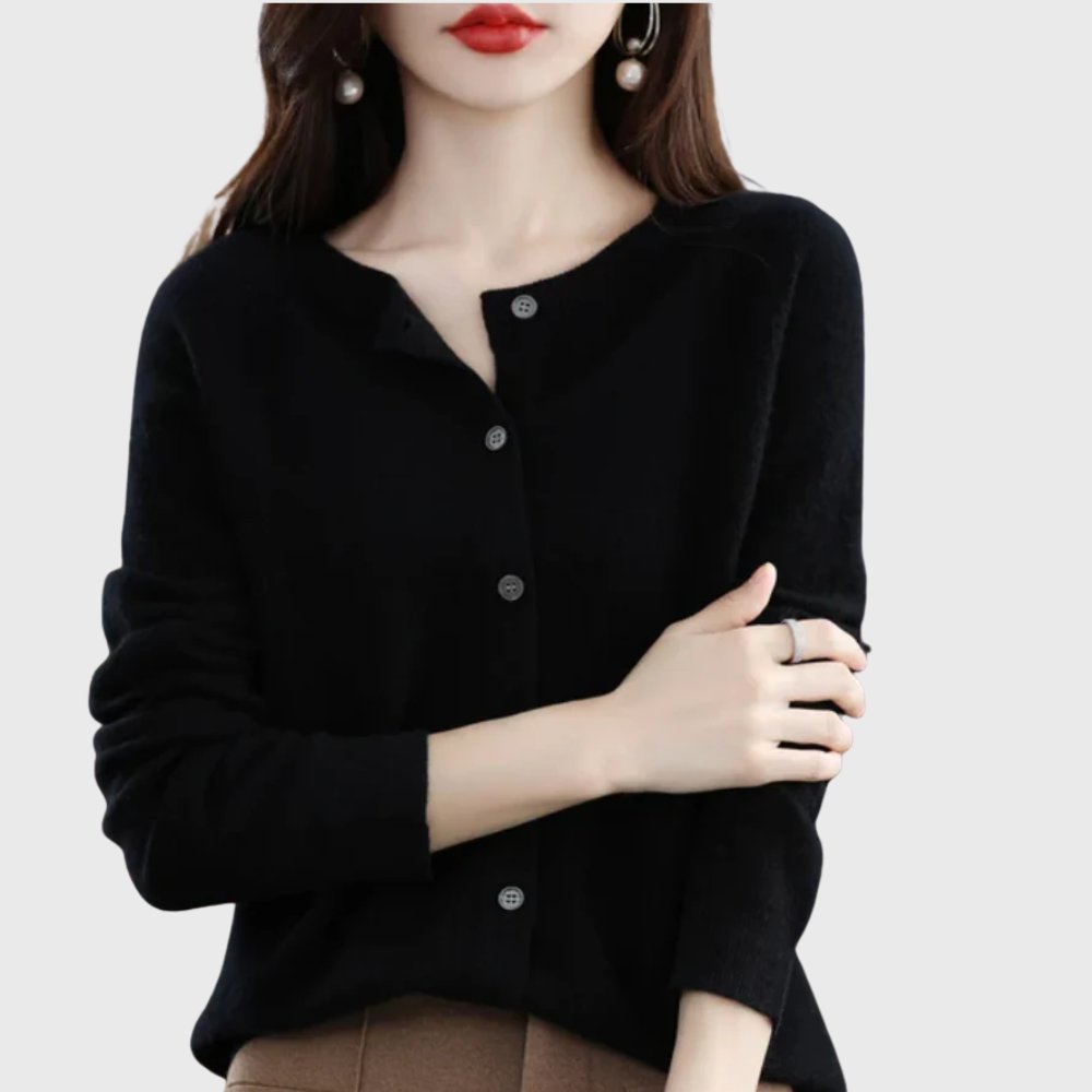 Relaxed fit women's long sleeve cardigan with round neck and button front. Perfect for layering.