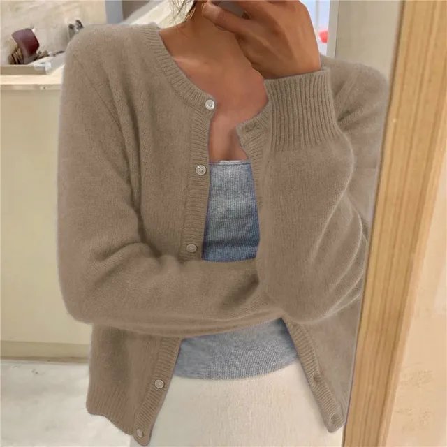 Stylish women's cropped button-front cardigan with a round neck, great for layering over dresses or tops.