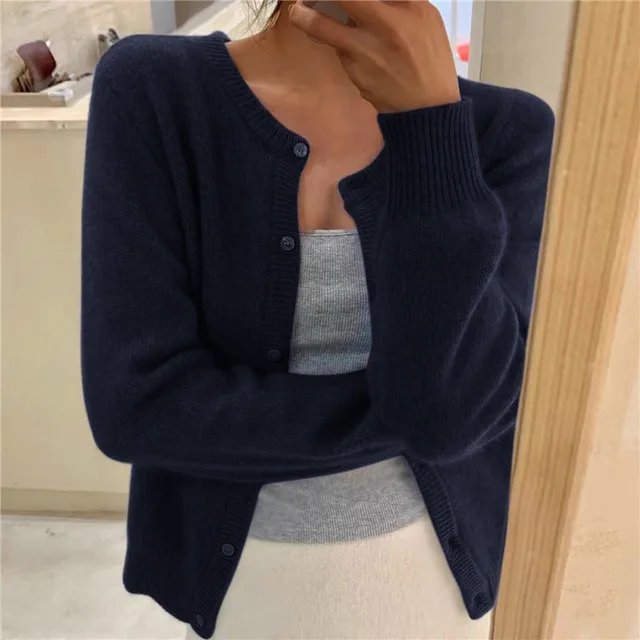 Comfortable women's relaxed fit button-front cardigan with a round neck, perfect for cozy & casual layering.