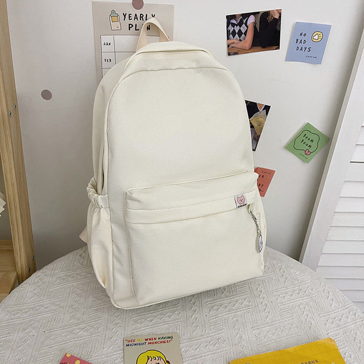 Stylish beige women's backpack featuring a trendy ruffled design and spacious compartments for daily essentials.