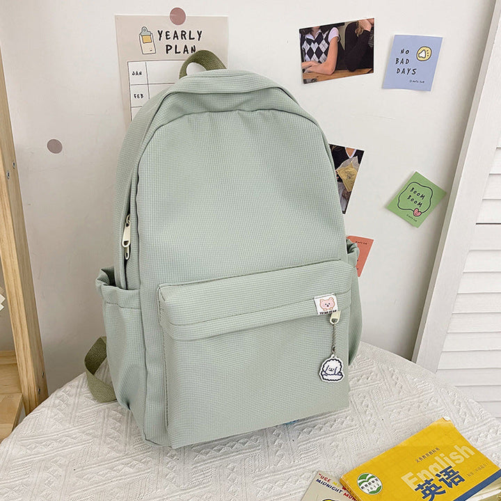 Modern women's fashion backpack with distinctive ruffled surface, an ideal accessory for casual outings.