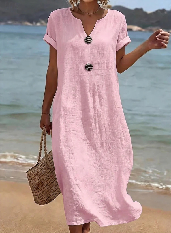 Flowing women's beach maxi dress with button detail, ideal for comfortable summer fashion & everyday elegance.