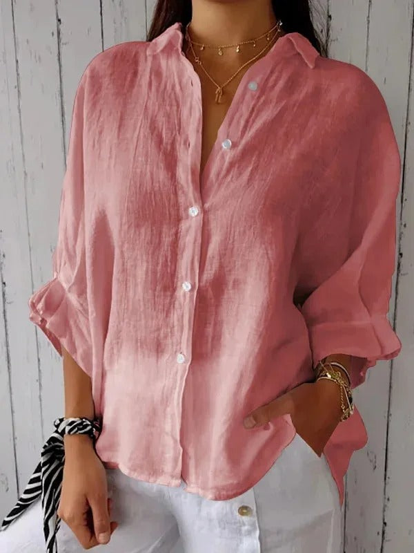 Classic women's button-up shirt, long sleeves, comfortable casual top for versatile fashion.