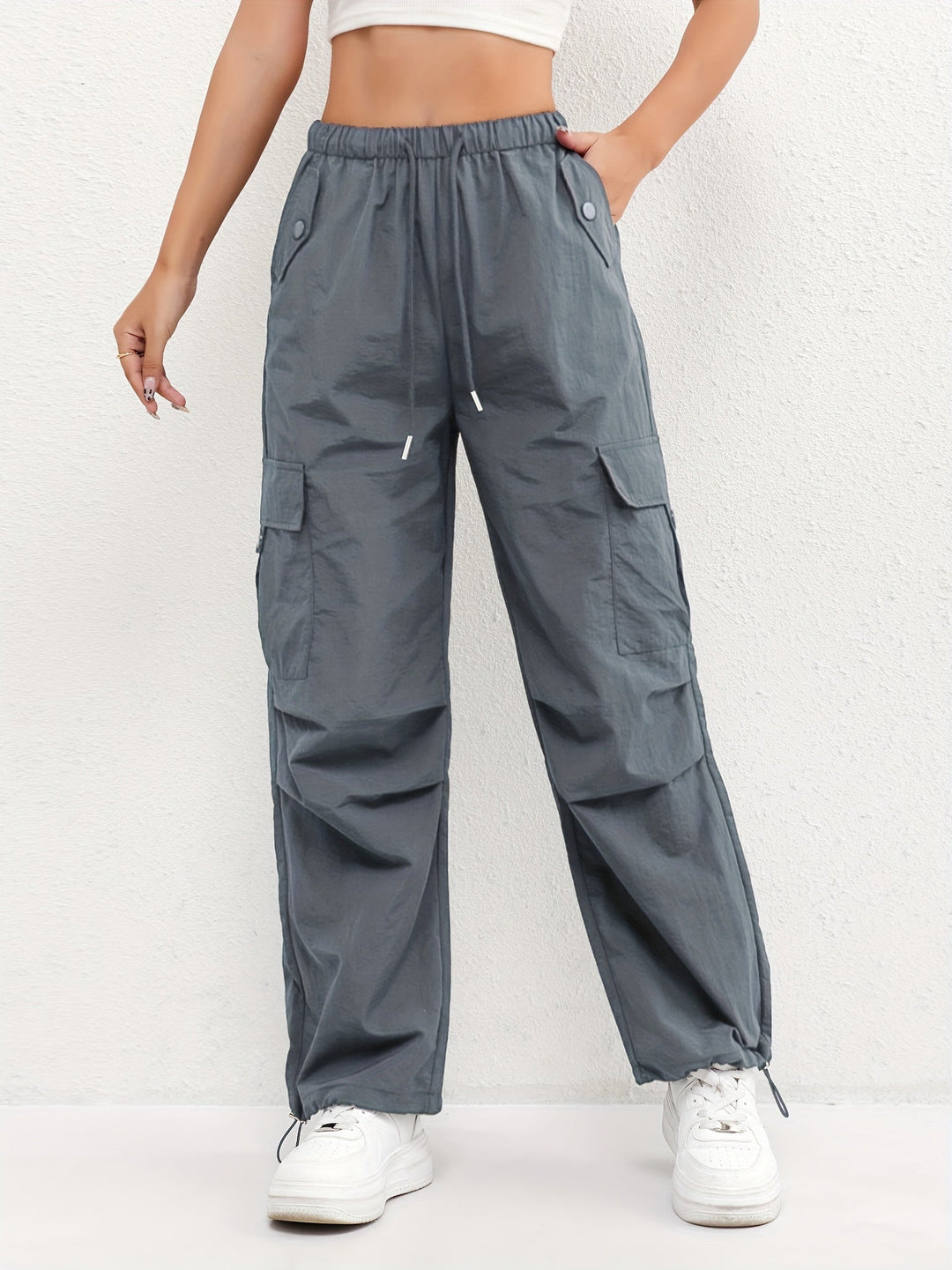 Women's comfortable drawstring cargo pants with side pockets, perfect for casual wear, travel, and streetwear style.