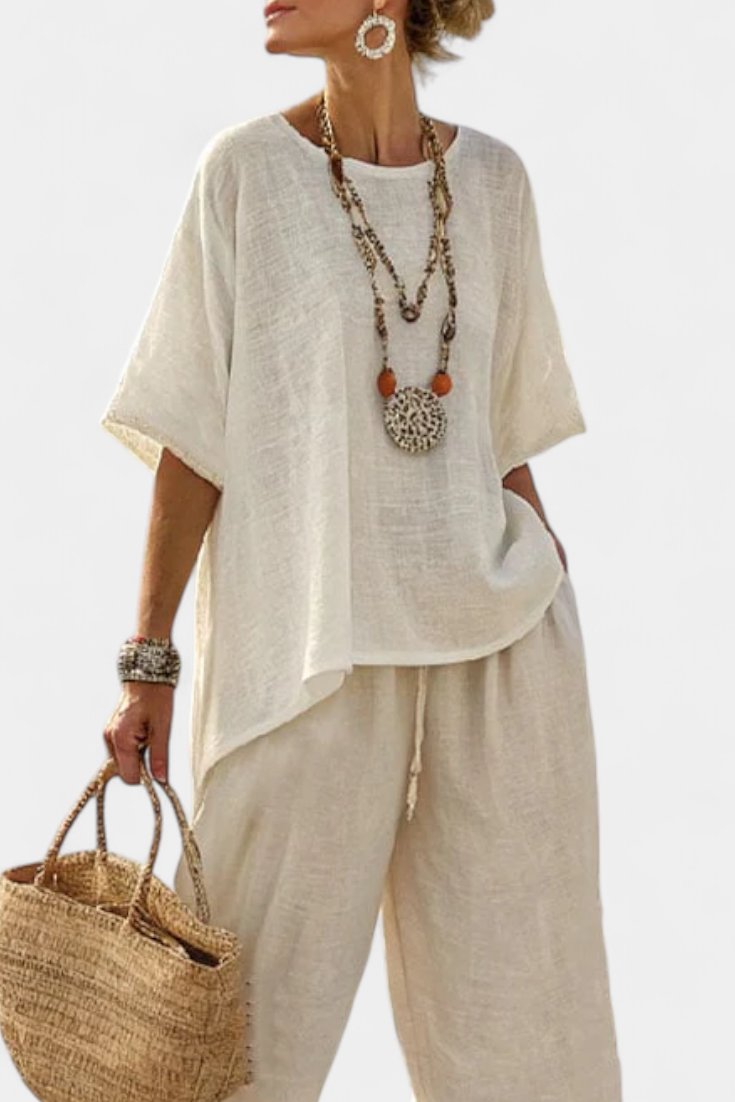 Versatile women's two-piece set featuring a stylish asymmetric top & comfortable wide-leg trousers for casual wear.