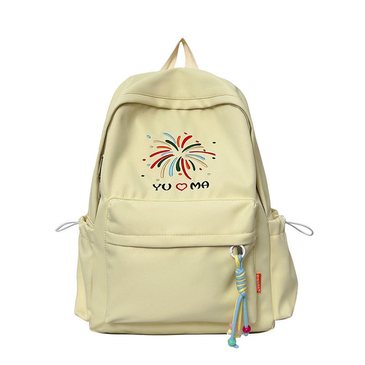Woman wearing a chic embroidered backpack, perfect for casual daily use, school, or travel adventures.