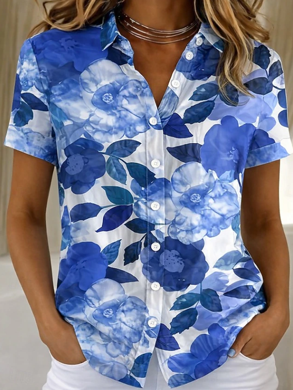 Patterned women's casual button-up blouse, featuring a beautiful floral print and short sleeves for summer.