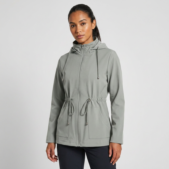 Relaxed fit women's long sleeve hooded jacket with functional drawstring waist for casual outerwear.
