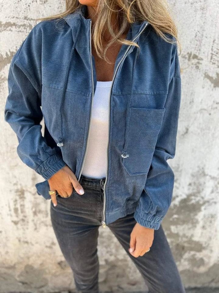 Zippered women's casual hooded jacket, ideal for versatile fall and winter layering.