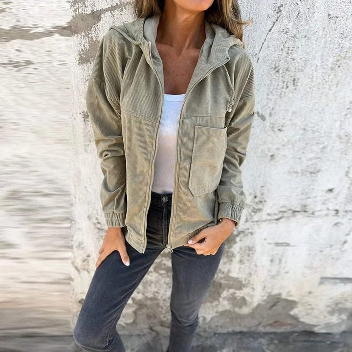 Back view of a women's casual hooded zip jacket, showcasing its comfortable, relaxed fit for active days.