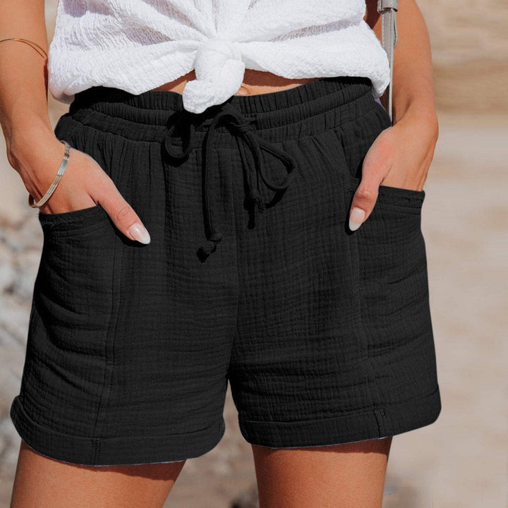 Relaxed fit women's summer shorts with elastic waist, drawstring, & pockets. Ideal for beach days, vacation, & daily comfort.