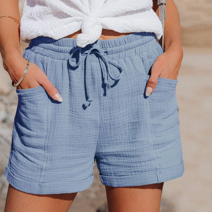 Comfortable lightweight women's shorts for casual summer style. Features an elastic waist, drawstring, & practical pockets.