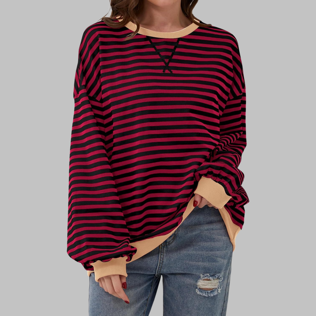 Model wearing a comfy striped long sleeve sweatshirt, perfect for relaxed, effortless casual style.