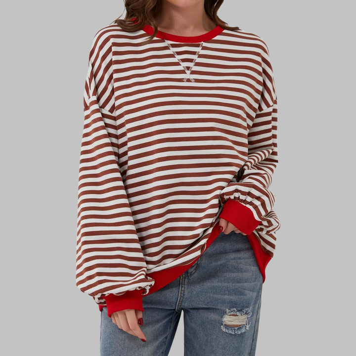 Back view of a women's relaxed fit striped long sleeve sweatshirt, emphasizing comfort.