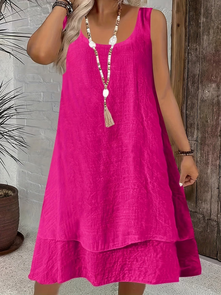 Chic women's loose-fit sleeveless dress, versatile for spring & summer fashion. Comfortable day dress.