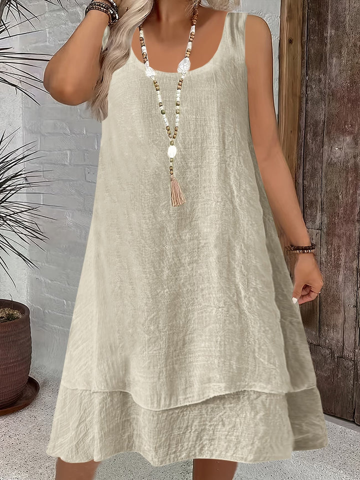 Effortless women's casual sleeveless day dress, versatile for everyday spring/summer style. Loose & chic.