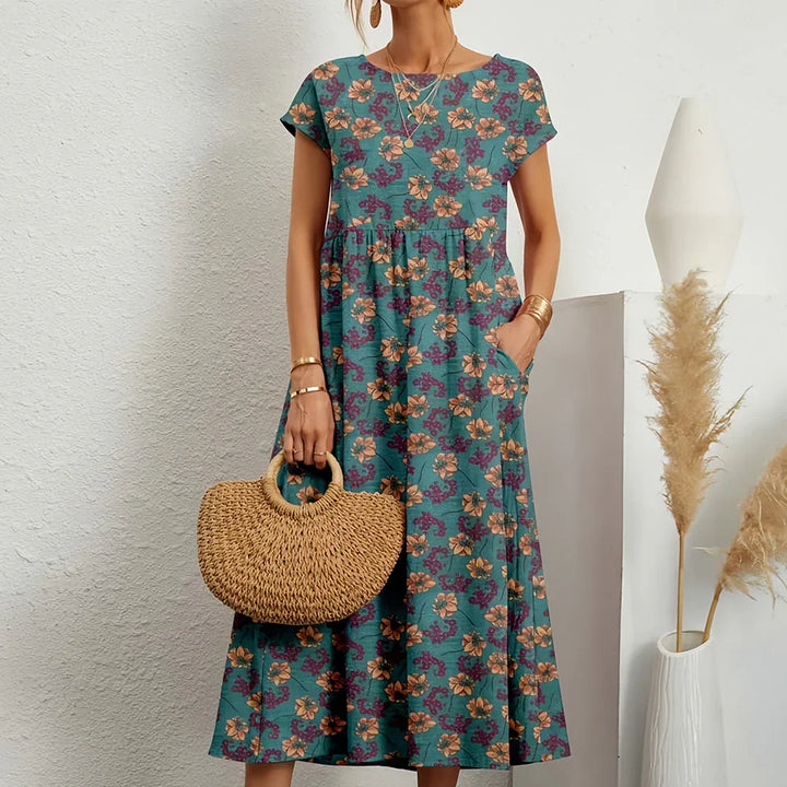 Versatile women's midi dress for effortless casual style, featuring a round neck & cap sleeves.